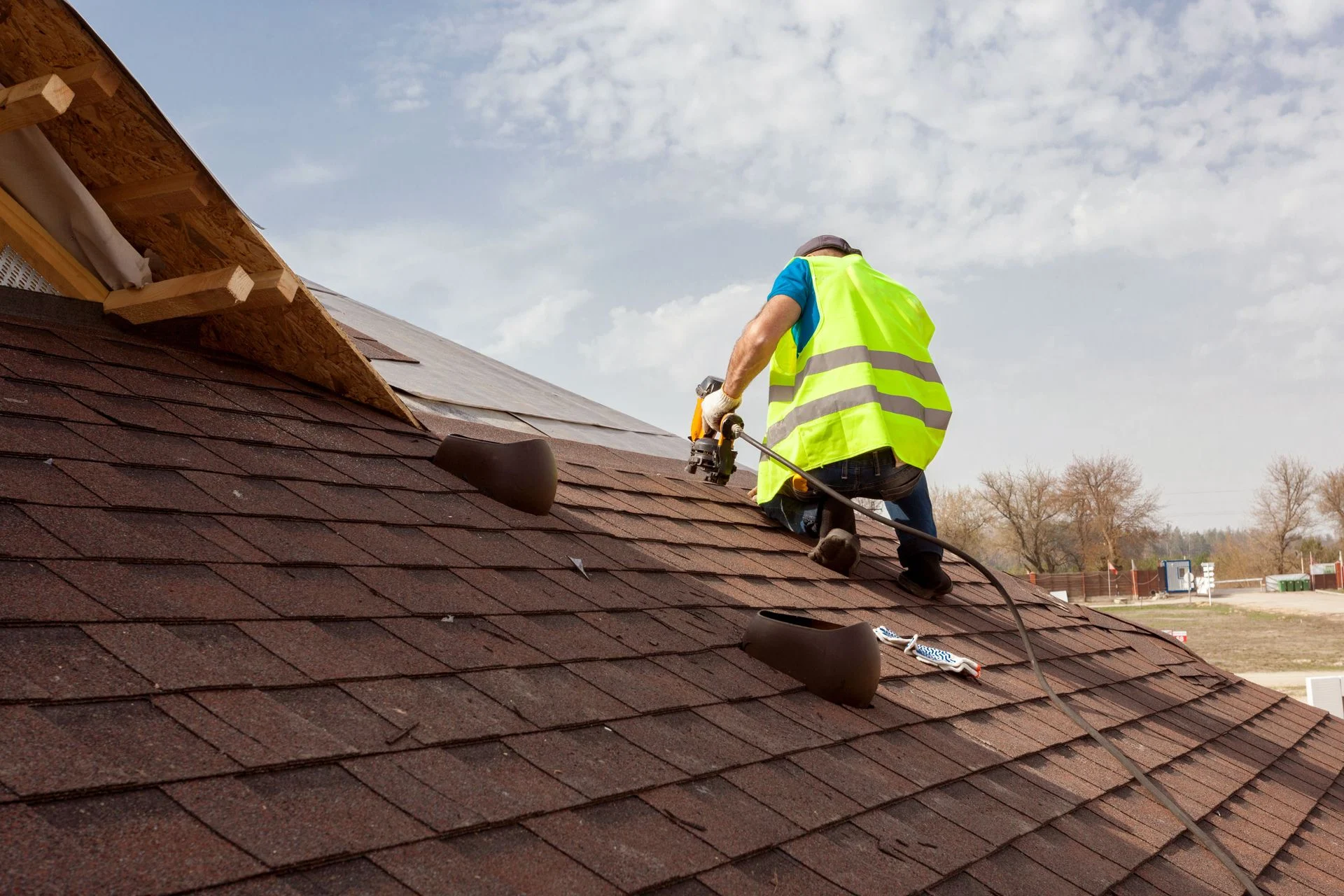 Single-family house with new shingle roofing installed by professionals